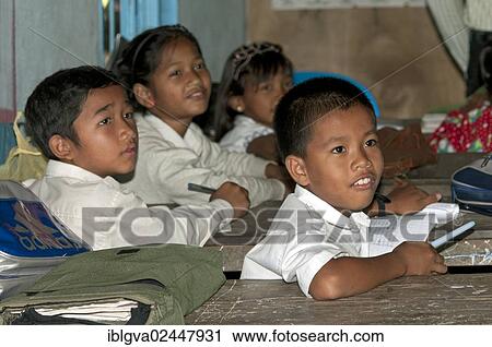 "Elementary students wearing school uniforms in a school of Areyskat, a suburb of Phnom Penh, Cambodia, Southeast Asia, Asia" View Large Photo Image Stock Image - "Elementary students wearing school uniforms in a school of Areyskat, a suburb of Phnom Penh, Cambodia, Southeast Asia, Asia". Fotosearch