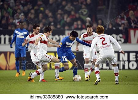 Stock Image - "Elyaniv Barda of KRC Genk, centre, is surrounded by VfB Stuttgart players Christian Gentner, William Kvist, Martin Harnik and Gotoku Sakai, from left, Mercedes-Benz Arena, Stuttgart, Baden-Wurttemberg, Germany, Europe". Fotosearch
