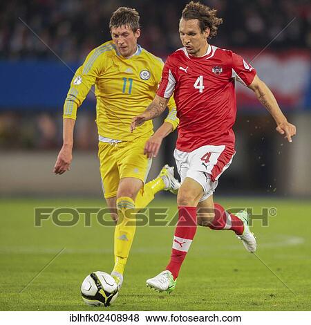 "Emanuel Pogatetz, #4 Austria, and Sergei Gridin, #11 Kazakhstan, fight for the ball during the WC qualifier soccer game on October 16, 2012 in Vienna, Austria, Europe" View Large Photo Image Stock Photo - "Emanuel Pogatetz, #4 Austria, and Sergei Gridin, #11 Kazakhstan, fight for the ball during the WC qualifier soccer game on October 16, 2012 in Vienna, Austria, Europe". Fotosearch
