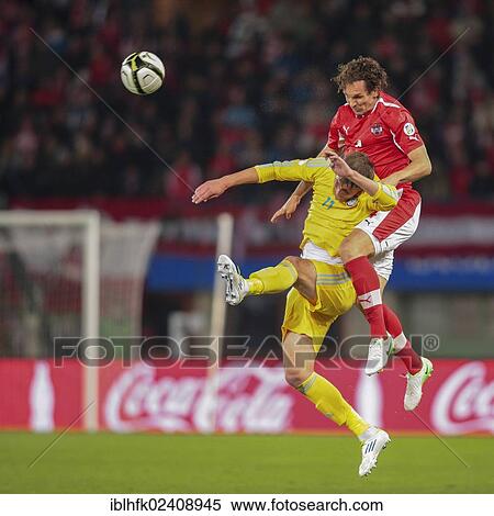 Stock Photography - "Emanuel Pogatetz, #4 Austria, and Sergei Gridin, #11 Kazakhstan, fight for the ball during the WC qualifier soccer game on October 16, 2012 in Vienna, Austria, Europe". Fotosearch