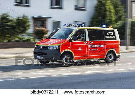Stock Image - "Emergency ambulance of the Hamburg Fire Department racing to a rescue mission, Hamburg, Germany, Europe". Fotosearch