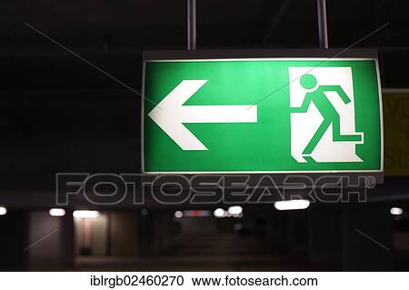 Emergency exit sign in a parking garage View Large Photo Image Stock Image - Emergency exit sign in a parking garage. Fotosearch