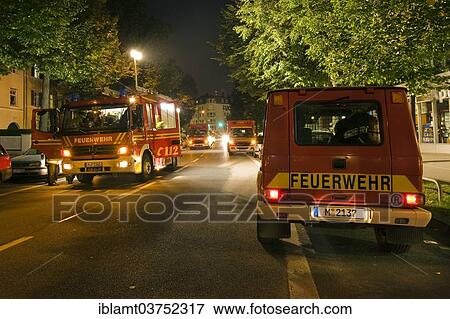 "Emergency vehicles of the Munich fire brigade during an operation, Munich, Upper Bavaria, Bavaria, Germany, Europe" View Large Photo Image Stock Photo - "Emergency vehicles of the Munich fire brigade during an operation, Munich, Upper Bavaria, Bavaria, Germany, Europe". Fotosearch