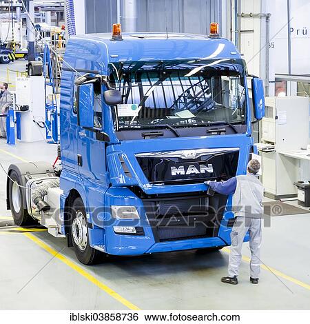 "Employee during the final inspection of a truck at MAN Truck and Bus AG, Munich, Upper Bavaria, Bavaria, Germany, Europe" View Large Photo Image Stock Photograph - "Employee during the final inspection of a truck at MAN Truck and Bus AG, Munich, Upper Bavaria, Bavaria, Germany, Europe". Fotosearch