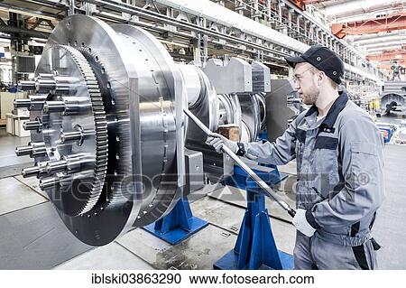 "Employee tightening a screw plug on the crankshaft of a marine engine, MAN Diesel and Turbo SE, Augsburg, Bavaria, Germany, Europe" View Large Photo Image Stock Image - "Employee tightening a screw plug on the crankshaft of a marine engine, MAN Diesel and Turbo SE, Augsburg, Bavaria, Germany, Europe". Fotosearch