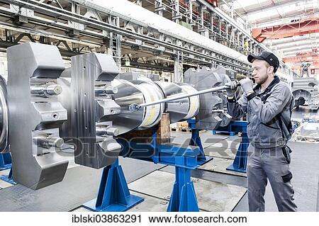 "Employee tightening a screw plug on the crankshaft of a marine engine, MAN Diesel and Turbo SE, Augsburg, Bavaria, Germany, Europe" View Large Photo Image Stock Image - "Employee tightening a screw plug on the crankshaft of a marine engine, MAN Diesel and Turbo SE, Augsburg, Bavaria, Germany, Europe". Fotosearch