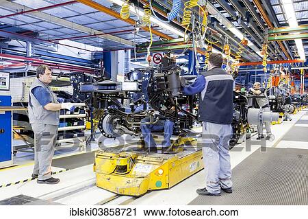"Employees assembling a chassis at MAN Truck and Bus AG, Munich, Upper Bavaria, Bavaria, Germany, Europe" View Large Photo Image Stock Image - "Employees assembling a chassis at MAN Truck and Bus AG, Munich, Upper Bavaria, Bavaria, Germany, Europe". Fotosearch