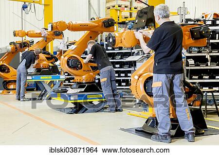 "Employees of the robot manufacturer KUKA AG during the assembly of the electrical system of KUKA robots, Augsburg, Bavaria, Germany, Europe" View Large Photo Image Picture - "Employees of the robot manufacturer KUKA AG during the assembly of the electrical system of KUKA robots, Augsburg, Bavaria, Germany, Europe". Fotosearch