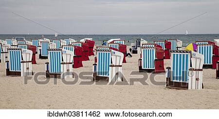 Stock Image - "Empty beach chairs on the Baltic coast, Warnemunde, Rostock, Mecklenburg-Western Pomerania, Germany, Europe". Fotosearch