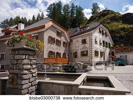 "Engadine house in Susch, fountain, Susch, Engadin, Unterengadin, Inn District, Canton of Graubunden, Switzerland, Europe" View Large Photo Image Stock Photo - "Engadine house in Susch, fountain, Susch, Engadin, Unterengadin, Inn District, Canton of Graubunden, Switzerland, Europe". Fotosearch