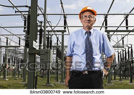 Stock Photo - "Engineer at the substation of the Transmission Control Center, TCC, of transmission network operator 50Hertz, Neuenhagen, Brandenburg, Germany, Europe". Fotosearch