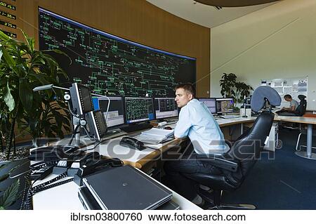 "Engineer sitting at his work station in the Transmission Control Center, TCC, of transmission network operator 50Hertz, Neuenhagen, Brandenburg, Germany, Europe" View Large Photo Image Stock Image - "Engineer sitting at his work station in the Transmission Control Center, TCC, of transmission network operator 50Hertz, Neuenhagen, Brandenburg, Germany, Europe". Fotosearch