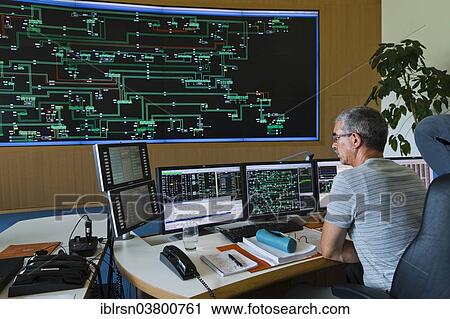 "Engineer sitting at his work station in the Transmission Control Center, TCC, of transmission network operator 50Hertz, Neuenhagen, Brandenburg, Germany, Europe" View Large Photo Image Stock Image - "Engineer sitting at his work station in the Transmission Control Center, TCC, of transmission network operator 50Hertz, Neuenhagen, Brandenburg, Germany, Europe". Fotosearch