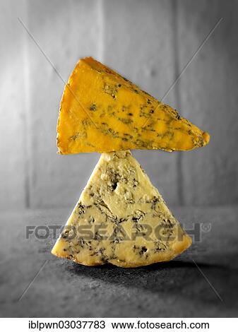 "English blue cheese wedges, Stilton bottom, Blacksticks top" View Large Photo Image Stock Image - "English blue cheese wedges, Stilton bottom, Blacksticks top". Fotosearch