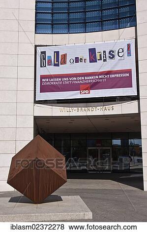 "Entrance area of the Willy-Brandt-House with a banner """"Geld oder Krise"""", German for """"money or crisis"""", Berlin, Germany, Europe" View Large Photo Image Stock Photo - "Entrance area of the Willy-Brandt-House with a banner """"Geld oder Krise"""", German for """"money or crisis"""", Berlin, Germany, Europe". Fotosearch