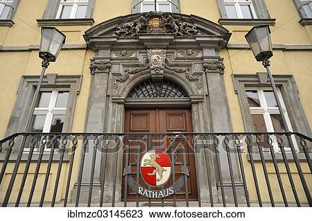"Entrance portal of a former office building, built in 1719, now the town hall displaying the town's coat of arms at front, crest of two Wuerzburg prince-bishops above door, Hassfurt, Lower Franconia, Bavaria, Germany, Europe" View Large Photo Image Stock Image - "Entrance portal of a former office building, built in 1719, now the town hall displaying the town's coat of arms at front, crest of two Wuerzburg prince-bishops above door, Hassfurt, Lower Franconia, Bavaria, Germany, Europe". Fotosearch