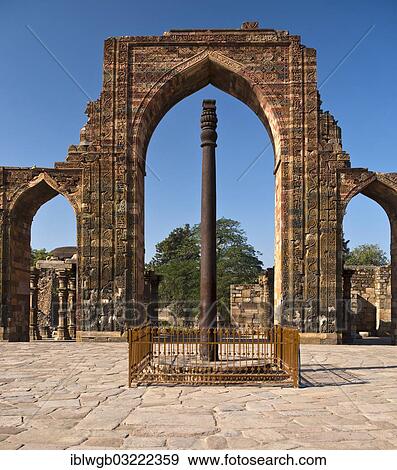 Stock Photo - "Entrance portal of the Quwwat-ul-Islam Masjid Mosque with relief decorations and an iron pillar in the courtyard, Qutb Minar, Delhi, India, Asia". Fotosearch
