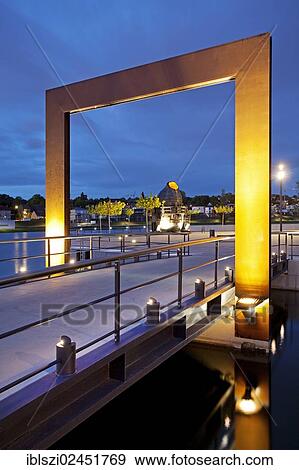 "Entrance to Kulturinsel, the cultural island in Phoenix Lake with the illuminated Thomas converter at dusk, Dortmund, North Rhine-Westphalia, Germany, Europe, PublicGround, Europe" View Large Photo Image Stock Photo - "Entrance to Kulturinsel, the cultural island in Phoenix Lake with the illuminated Thomas converter at dusk, Dortmund, North Rhine-Westphalia, Germany, Europe, PublicGround, Europe". Fotosearch