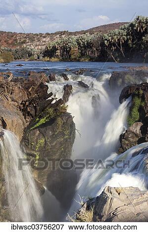 Stock Photo - "Epupa Falls, waterfall, formed by the Kunene River directly on the border with Angola, about 40 m, Epupa, Kaokoland, Kunene, Namibia, Africa". Fotosearch