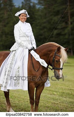 "Equestrienne wearing a Venetian costume riding a Welsh Cob, sorrel, Northern Tyrol, Austria, Europe" View Large Photo Image Stock Photo - "Equestrienne wearing a Venetian costume riding a Welsh Cob, sorrel, Northern Tyrol, Austria, Europe". Fotosearch