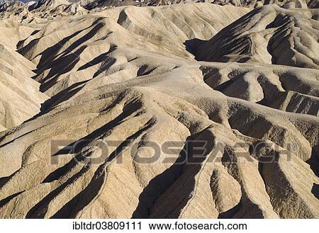 Stock Image - "Eroded badlands in the Gower Gulch seen from Zabriskie Point, Death Valley National Park, California, USA". Fotosearch