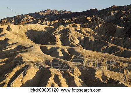 "Eroded badlands in the Gower Gulch seen from Zabriskie Point in the evening light, Death Valley National Park, California, USA" View Large Photo Image Stock Image - "Eroded badlands in the Gower Gulch seen from Zabriskie Point in the evening light, Death Valley National Park, California, USA". Fotosearch