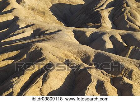 "Eroded badlands in the Gower Gulch seen from Zabriskie Point in the evening light, Death Valley National Park, California, USA" View Large Photo Image Stock Photo - "Eroded badlands in the Gower Gulch seen from Zabriskie Point in the evening light, Death Valley National Park, California, USA". Fotosearch