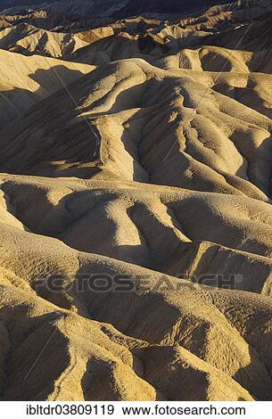 "Eroded badlands in the Gower Gulch seen from Zabriskie Point in the evening light, Death Valley National Park, California, USA" View Large Photo Image Stock Photo - "Eroded badlands in the Gower Gulch seen from Zabriskie Point in the evening light, Death Valley National Park, California, USA". Fotosearch