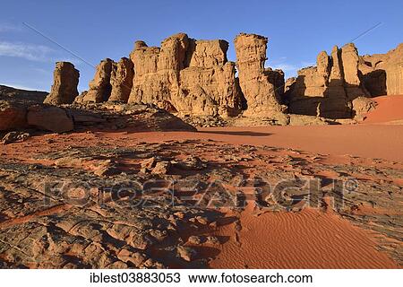 "Eroded sandstone rocks and dunes at the cirque, Tadrart, Tassili n’Ajjer National Park, Unesco World Heritage Site, Sahara, Algeria, Africa" View Large Photo Image Stock Image - "Eroded sandstone rocks and dunes at the cirque, Tadrart, Tassili n’Ajjer National Park, Unesco World Heritage Site, Sahara, Algeria, Africa". Fotosearch
