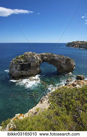 Stock Image - "Es Pontas natural arch, Cala Llombards, Santanyi, Majorca, Balearic Islands, Spain, Europe". Fotosearch