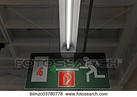 "Escape route sign in the empty shipping hall of a former department store, Nuremberg, Middle Franconia, Bavaria, Germany, Europe" View Large Photo Image Stock Photo - "Escape route sign in the empty shipping hall of a former department store, Nuremberg, Middle Franconia, Bavaria, Germany, Europe". Fotosearch