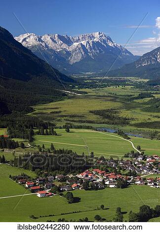 Stock Image - "Eschenlohe, panoramic view from Heldenkreuz, Wetterstein Range, Loisach, Loisachtal Valley, Werdenfels, Upper Bavaria, Bavaria, Germany, Europe". Fotosearch