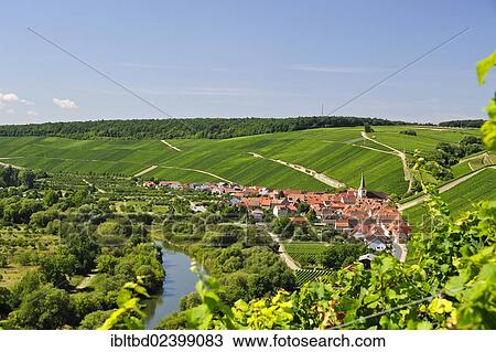 Stock Image - "Escherndorf on the Volkach river, Bavaria, Germany, Europe". Fotosearch