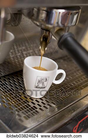 "Espresso coffee pouring into a cup, espresso machine" View Large Photo Image Picture - "Espresso coffee pouring into a cup, espresso machine". Fotosearch
