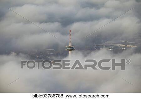 Stock Photo - "Essen television tower through the clouds, aerial view, Essen, Ruhr area, North Rhine-Westphalia, Germany, Europe". Fotosearch