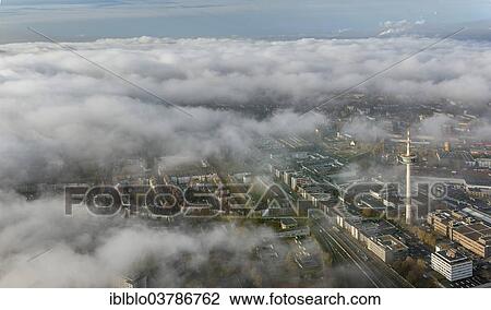 "ETEC, Essen Technology and Development Centre, and television tower through the clouds, city centre of Essen, aerial view, Essen, Ruhr area, North Rhine-Westphalia, Germany, Europe" View Large Photo Image Stock Image - "ETEC, Essen Technology and Development Centre, and television tower through the clouds, city centre of Essen, aerial view, Essen, Ruhr area, North Rhine-Westphalia, Germany, Europe". Fotosearch