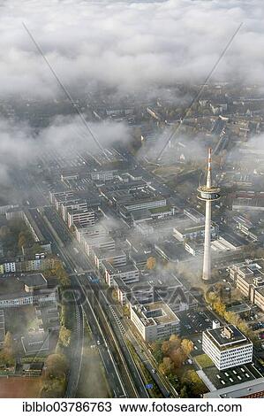 "ETEC, Essen Technology and Development Centre, and television tower through the clouds, aerial view, Essen, Ruhr area, North Rhine-Westphalia, Germany, Europe" View Large Photo Image Stock Image - "ETEC, Essen Technology and Development Centre, and television tower through the clouds, aerial view, Essen, Ruhr area, North Rhine-Westphalia, Germany, Europe". Fotosearch
