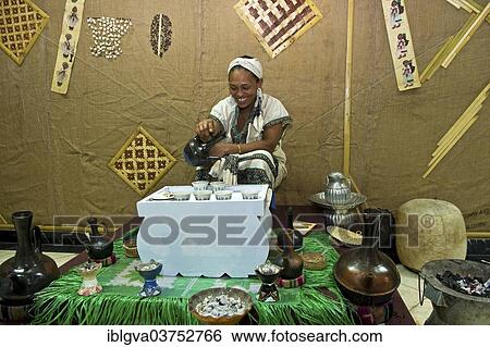 "Ethiopian woman pours coffee in a traditional coffee ceremony, Addis Ababa, Oromia Region, Ethiopia, Africa" View Large Photo Image Stock Photograph - "Ethiopian woman pours coffee in a traditional coffee ceremony, Addis Ababa, Oromia Region, Ethiopia, Africa". Fotosearch