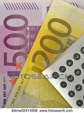 Stock Photo - Euro banknotes and a calculator. Fotosearch