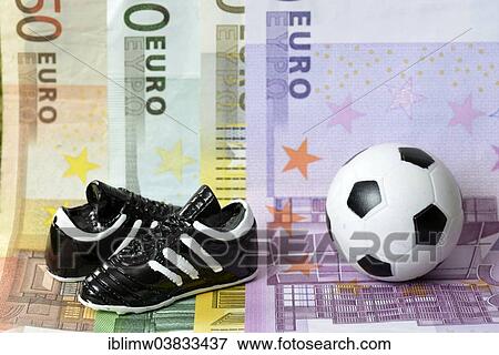 "Euro banknotes, football boots, football" View Large Photo Image Stock Photo - "Euro banknotes, football boots, football". Fotosearch