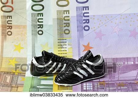 Stock Photography - "Euro banknotes, football boots". Fotosearch
