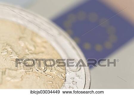 "Euro crisis, a 2-euro coin and the European flag on a 50 euro banknote at back" View Large Photo Image Stock Photo - "Euro crisis, a 2-euro coin and the European flag on a 50 euro banknote at back". Fotosearch