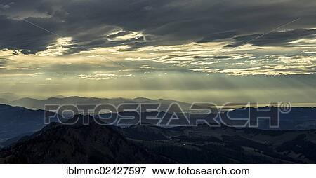 Stock Photo - "Evening clouds seen from Mt. Hochgrat with view of Lake Constance, Oberstaufen, Bavaria, Germany, Europe". Fotosearch