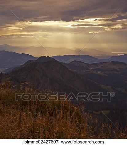 "Evening clouds seen from Mt. Hochgrat, Oberstaufen, Bavaria, Germany, Europe" View Large Photo Image Stock Photo - "Evening clouds seen from Mt. Hochgrat, Oberstaufen, Bavaria, Germany, Europe". Fotosearch