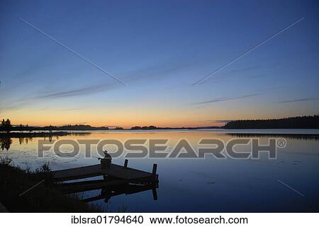 "Evening mood with a fisherman on Lake Saimaa, Finland, Europe" View Large Photo Image Stock Image - "Evening mood with a fisherman on Lake Saimaa, Finland, Europe". Fotosearch