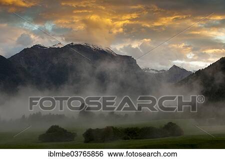 "Evening mood with ascending mist in autumn, Val Muestair, South Tyrol province, Trentino-Alto Adige, Italy, Europe" View Large Photo Image Stock Photograph - "Evening mood with ascending mist in autumn, Val Muestair, South Tyrol province, Trentino-Alto Adige, Italy, Europe". Fotosearch