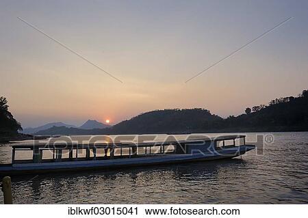 "Evening mood with sunset over the Mekong River, passenger boat at front, Mekong, Luang Prabang, Luang Prabang Province, Laos, Asia" View Large Photo Image Stock Image - "Evening mood with sunset over the Mekong River, passenger boat at front, Mekong, Luang Prabang, Luang Prabang Province, Laos, Asia". Fotosearch