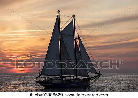 "Evening sailing, two-masted schooner OBAN at the Hanse Sail 2014 Warnemunde, Mecklenburg-Western Pomerania, Germany, Europe" View Large Photo Image Stock Photo - "Evening sailing, two-masted schooner OBAN at the Hanse Sail 2014 Warnemunde, Mecklenburg-Western Pomerania, Germany, Europe". Fotosearch