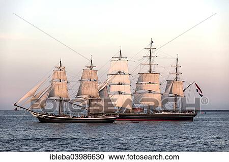 "Evening sailing with the Stad Amsterdam in the foreground, Hanse Sail 2014 Warnemunde, Mecklenburg-Western Pomerania, Germany, Europe" View Large Photo Image Stock Image - "Evening sailing with the Stad Amsterdam in the foreground, Hanse Sail 2014 Warnemunde, Mecklenburg-Western Pomerania, Germany, Europe". Fotosearch