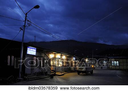 "Evening street scene with a market store, Jakar, Bumthang district, Bhutan, Asia" View Large Photo Image Stock Photo - "Evening street scene with a market store, Jakar, Bumthang district, Bhutan, Asia". Fotosearch